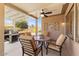 Covered patio featuring comfortable seating, a ceiling fan, and a built-in grill at 17204 W Cordova Ct, Surprise, AZ 85387