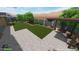 Rendering of backyard design featuring a patio with pergola, desert landscaping and lawn at 18618 E Mockingbird Dr, Queen Creek, AZ 85142