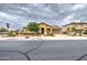 Street view of a one-story home featuring desert landscaping, and an attached garage with a driveway at 18618 E Mockingbird Dr, Queen Creek, AZ 85142