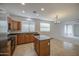 Stylish kitchen with wooden cabinets, granite countertops, tile flooring and stainless steel appliances at 18618 E Mockingbird Dr, Queen Creek, AZ 85142