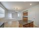 Spacious kitchen with wooden cabinets, granite countertops, tile flooring and center island open to the living area at 18618 E Mockingbird Dr, Queen Creek, AZ 85142