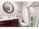 Neat bathroom showcases vanity with framed mirror and a glass enclosed shower at 18635 W Miami St, Goodyear, AZ 85338
