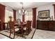 Charming dining room featuring a table set for a meal, enhanced by decorative curtains at 18635 W Miami St, Goodyear, AZ 85338