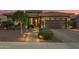 Inviting front entrance with a brick pathway, lush landscaping, and a warm welcome sign at 18635 W Miami St, Goodyear, AZ 85338