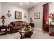 Inviting living room showcasing a comfortable couch, decorative pillows, and tasteful wall art at 18635 W Miami St, Goodyear, AZ 85338