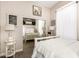 Bright bedroom featuring soft neutral tones, a sliding closet door and an inviting bed at 18635 W Miami St, Goodyear, AZ 85338