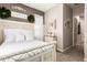 Comfortable bedroom showcasing elegant decor, soft white bedding, and warm, inviting colors at 18635 W Miami St, Goodyear, AZ 85338