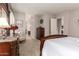 Comfortable main bedroom with a view of the en suite bathroom and a dresser at 18635 W Miami St, Goodyear, AZ 85338
