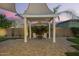 Picturesque backyard pergola with comfortable seating, ideal for outdoor relaxation and enjoying the sunset at 18635 W Miami St, Goodyear, AZ 85338