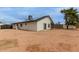 Gravel-covered backyard with solar panels visible on the house and ample space at 18829 N 15Th Pl, Phoenix, AZ 85024