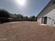 View of backyard featuring neutral landscaping and home exterior at 18829 N 15Th Pl, Phoenix, AZ 85024