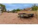 Large, gravel backyard with a trailer and fenced perimeter for added privacy at 18829 N 15Th Pl, Phoenix, AZ 85024