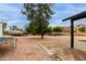 Large backyard featuring mature trees, a trampoline, and patio at 18829 N 15Th Pl, Phoenix, AZ 85024