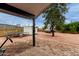 Spacious backyard with covered patio, a trampoline, and mature trees at 18829 N 15Th Pl, Phoenix, AZ 85024