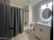 Well-lit bathroom features a shower-tub combo and a vanity with granite countertop at 18829 N 15Th Pl, Phoenix, AZ 85024