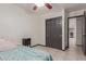 Bedroom featuring a ceiling fan, closet with sliding doors and dark trim at 18829 N 15Th Pl, Phoenix, AZ 85024