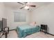 Bedroom showcasing neutral walls, ceiling fan, and a cozy bed at 18829 N 15Th Pl, Phoenix, AZ 85024