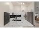 Modern kitchen features marble countertops, black backsplash, stainless steel appliances, and a high, vaulted ceiling at 18829 N 15Th Pl, Phoenix, AZ 85024