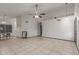Large living room featuring vaulted ceilings, tile floors and a ceiling fan at 18829 N 15Th Pl, Phoenix, AZ 85024