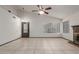 Large living room area with tile floors, a fireplace and vaulted ceilings at 18829 N 15Th Pl, Phoenix, AZ 85024