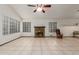 Large living area featuring tile floors, a fireplace and vaulted ceilings at 18829 N 15Th Pl, Phoenix, AZ 85024