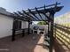 Covered outdoor kitchen area featuring a built-in grill, brick pavers, and seating, perfect for entertaining and outdoor dining at 18829 N 15Th Pl, Phoenix, AZ 85024