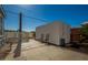 Enclosed backyard with a shed, two chairs, and a concrete patio at 19041 N Pierson Rd, Peoria, AZ 85373