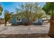 Charming single-story home featuring a quaint white picket fence and desert landscaping for a welcoming curb appeal at 19041 N Pierson Rd, Peoria, AZ 85373