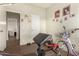 Workout area with dark wood floors and a white door to another room at 19041 N Pierson Rd, Peoria, AZ 85373