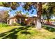 Inviting single-story home with a tile roof, attached garage, and well-maintained front yard at 19220 N 93Rd Ave, Peoria, AZ 85382