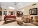 Spacious living room with natural light, comfortable seating, and a seamless flow to other spaces at 19220 N 93Rd Ave, Peoria, AZ 85382