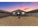 The backyard has a block fence, patio, and desert landscaping at 19924 W Rancho Dr, Litchfield Park, AZ 85340