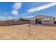 Spacious backyard with block fence, patio area, and potential for landscaping at 19924 W Rancho Dr, Litchfield Park, AZ 85340