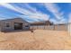 Backyard view shows block fence, patio, and space for customization at 19924 W Rancho Dr, Litchfield Park, AZ 85340
