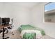 Guest bedroom is brightly illuminated with a window, and accommodates a desk and bed at 19924 W Rancho Dr, Litchfield Park, AZ 85340