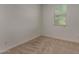 Cozy bedroom with carpet, a window with blinds, and ample electrical outlets at 19924 W Rancho Dr, Litchfield Park, AZ 85340