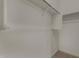 A practical closet featuring a sturdy metal rod and shelf for optimal organization at 19924 W Rancho Dr, Litchfield Park, AZ 85340