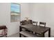 Cozy dining area with wood table and chairs, bench seating, and natural light at 19924 W Rancho Dr, Litchfield Park, AZ 85340