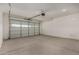 Spacious garage with concrete floor and a large door, offering ample parking and storage at 19924 W Rancho Dr, Litchfield Park, AZ 85340
