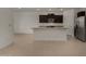 Modern kitchen featuring stainless steel appliances, granite countertops, and tile flooring at 19924 W Rancho Dr, Litchfield Park, AZ 85340