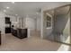 Bright kitchen with stainless steel appliances, an island with granite countertops, and sliding door access at 19924 W Rancho Dr, Litchfield Park, AZ 85340