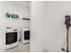 Laundry room has both a front loading washer and dryer, and includes an overhead shelf at 19924 W Rancho Dr, Litchfield Park, AZ 85340