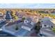 Desert home boasts solar panels, a tile roof, an attached garage, and desert landscaping with palm trees at 22491 W Woodlands Ave, Buckeye, AZ 85326