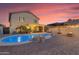 Backyard oasis featuring pool, water feature, lounge seating, and patio area at 22491 W Woodlands Ave, Buckeye, AZ 85326