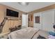 Well-lit bedroom featuring window, modern ceiling fan, and decorated walls at 22491 W Woodlands Ave, Buckeye, AZ 85326