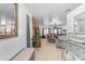 Inviting entryway with neutral tones, a mirrored wall, and a glimpse into the spacious living area at 22491 W Woodlands Ave, Buckeye, AZ 85326