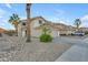 Inviting two-story home featuring desert landscaping, a two-car garage, and a charming entrance at 22491 W Woodlands Ave, Buckeye, AZ 85326