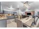 Bright, open-concept kitchen and dining area with stainless steel appliances at 22491 W Woodlands Ave, Buckeye, AZ 85326