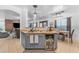 Kitchen with a breakfast bar area, featuring mini fridge and ample counter space at 22491 W Woodlands Ave, Buckeye, AZ 85326