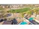 Backyard view showcasing a private pool with golf course views, perfect for relaxation and entertainment at 22491 W Woodlands Ave, Buckeye, AZ 85326